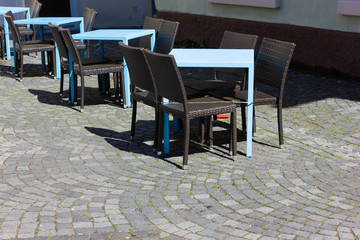 cafe with table and chairs at street