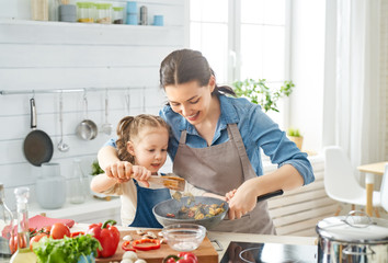 Happy family in the kitchen.