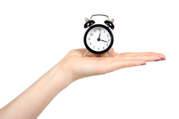 Hand with black retro alarm clock, classic watches with bells.