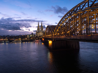 Fototapeta na wymiar December, 2018: Night view of Hohenzollern Bridge and the cathedral in Cologne, Germany