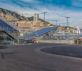 Monte Carlo panorama with luxury yachts and grand stands by the in harbor for Grand Prix F1 race in...