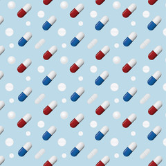 Pattern of different pills and capsules isolated on blue  background