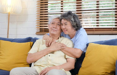 Senior asian couple in happy moment at home living room background, people emotional