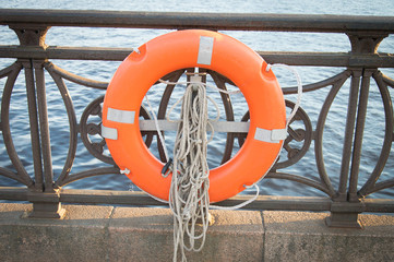 Safety ring attched to the railings of the city river embankment