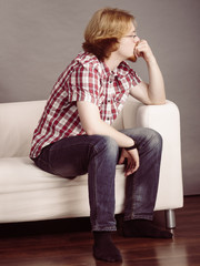 Obraz premium Young man thinking and sitting