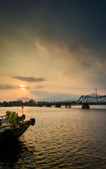 bridge and river at sunset in kampot cambodia
