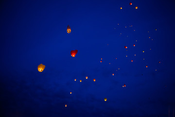 The Chinese lantern flies up highly in the sky.