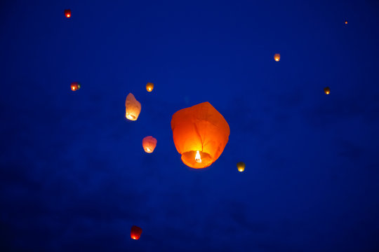 The Chinese lantern flies up highly in the sky.