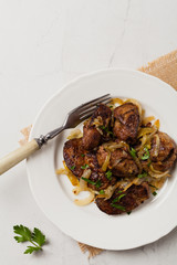 Fried chicken liver with onions.