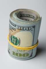 Close-up rolled American dollars banknotes.