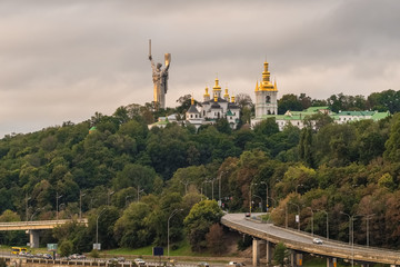 Kyiv cityscape with with Kiev Pechersk Lavra monastery and the Motherland Monument