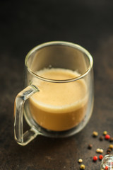 coffee with milk (cappuccino or latte) flavored drink in a transparent cup. food background. top