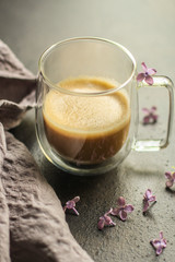 coffee with milk (cappuccino or latte) flavored drink in a transparent cup. food background. top
