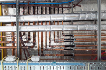 insulates hot water pipes and copper pipes hang from the subceiling
