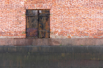 old rusty door on old brick wall background