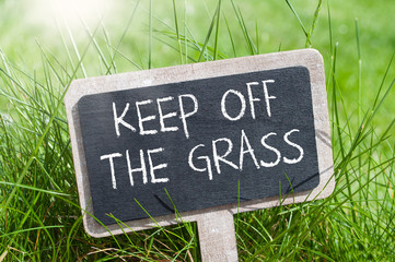 Chalkboard with message Keep off the grass