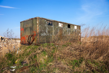 Fototapeta na wymiar Old abandoned shed for builders