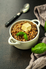 buckwheat porridge and a piece of butter (delicious food) homemade dish. food background. top