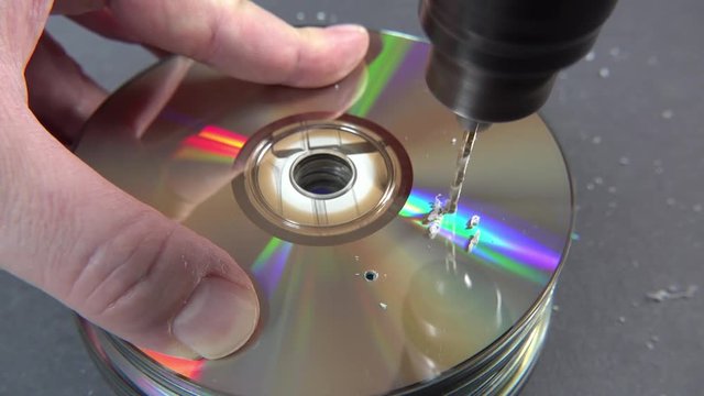 Concept of deleting big data by drilling a hole into the DVD RAM