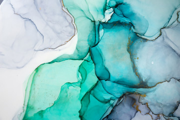 Naklejka premium Alcohol ink sea texture. Contemporary art. Spots of oil paint. Abstract art background. Multicolored bright texture. Fragment of artwork. Modern art. Inspired by the sky, as well as steam and smoke.
