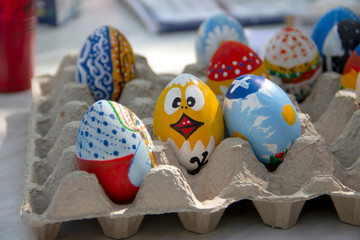 Fototapeta premium Wooden painted eggs on a white background