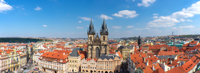 Naklejka na ściany i meble Outdoor sunny panoramic aerial scenery of rooftop in old town, city skyline, Church of Our Lady before Týnand at Old Town Square from Astronomical Clock tower in Prague, Czech Republic. 