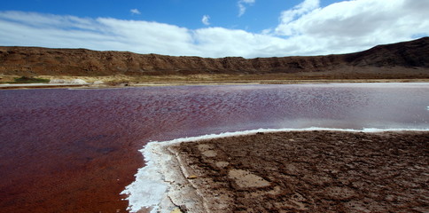 Red water in the salt evaporation pond on Sal, Cape Verde Island