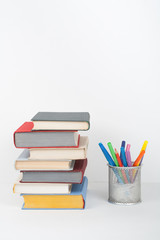 Book stacking. Open book, hardback books white background. Back to school. Copy space for text