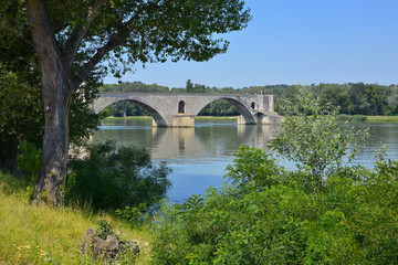 Fototapeta na wymiar Famous Pont of Saint Bénézet on the Petit Rhône at Avignon, a commune in south-eastern France in the department of Vaucluse on the left bank of the Rhône rive.