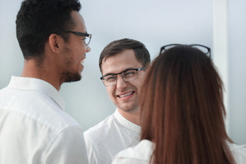 close up. business colleagues standing in a bright office