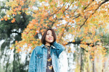 young woman in autumn park