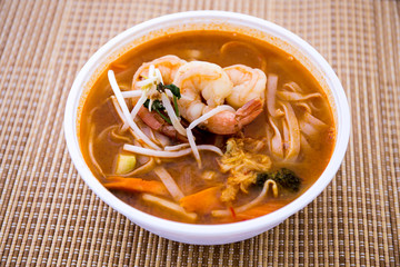 Tom Yam kung Spicy Thai soup in bowl