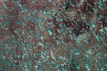Ancient wall texture with patina or copper oxide stains. Grunge rusty background. Antique surface structure