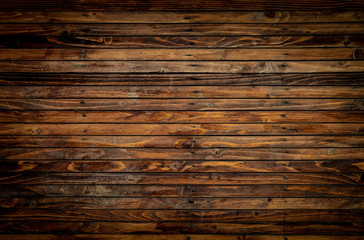 Wooden floor closeup view. Vintage brown wood wall texture with vignette