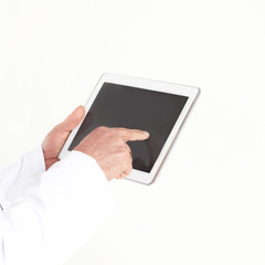 close up.doctor tapping the screen of the digital tablet .isolated on white background