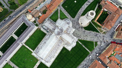 Aerial view of the Leaning Tower of Pisa, Cathedral of Santa Maria Assunta and Baptistery in Miracoli Square, Pisa, Tuscany, Italy.