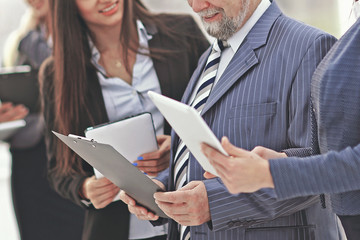 close up.business team with clipboard talking to the Manager