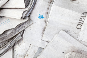 Useless paper documents on the landfill