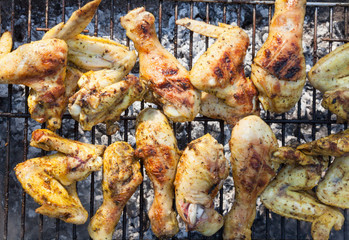 Chicken legs and wings on the grill