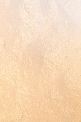 Frost in window at warm sunlight defocused