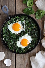 Skillet Poached Eggs with Spinach. Overhead view