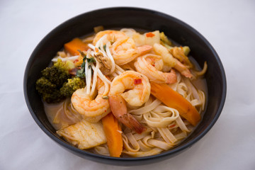 Tom Yam kung Spicy Thai soup in bowl