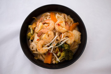 Tom Yam kung Spicy Thai soup in bowl