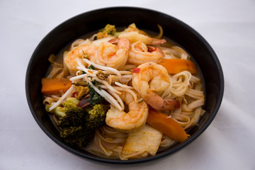 Tom Yam kung Spicy Thai soup in bowl