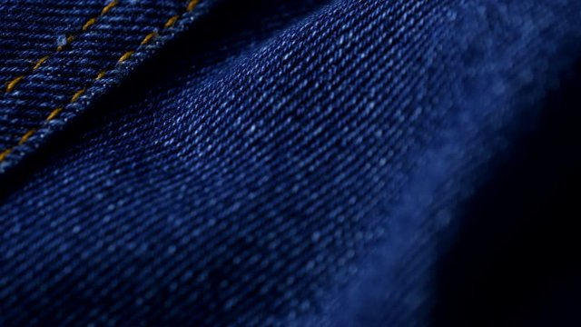 Blue denim jeans close up 4K stock footage. Blue denim Jeans in close up with a sliding camera move.