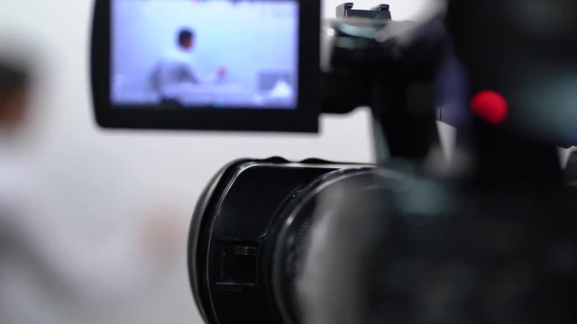 The video lessons on English language, Camera operator working with a cinema broadcast TV camera