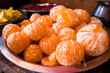 Heap of fresh ripe peeled oranges or tangerines in a bowl - Image