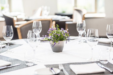 Luxury table with glasses, napkins and cutlery in restaurant or hotel
