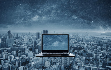 Computer laptop with futuristic city background. Computer laptop technology, digital data technology