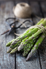 Bunch of fresh asparagus on wooden table